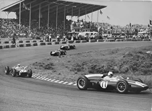 Grandstands: The racing driver Jack Brabham (left) at the Grand
