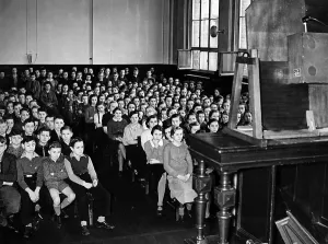 Transmitted: A radio broadcast is transmitted in a school, 1939