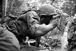 Stocktrek Images: Radio operator with a M1911.45 caliber pistol
