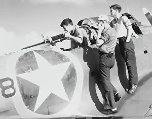 Loud: A radioman gunner fires a machine gun on the