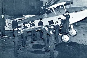 Fitting: RAF cadets fitting a wing onto a fighter plane, WW2