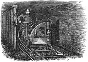 Hydrocarbon: Rail mounted coal cutting machine powered by compressed