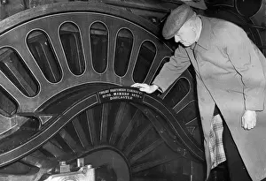 Railwayman: Former railwayman views engine at exhibition, London