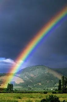 Droplets: Rainbow Against Dark Storm Clouds Hood River Valley Orego