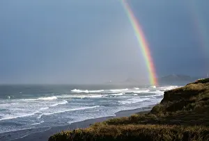 Refraction: Rainbow over pacific ocean and coast newport