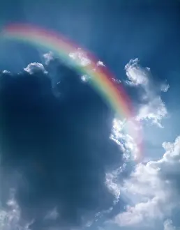 Refraction: RAINBOW IN SKY WITH SUN RAYS COMING FROM CLOUD