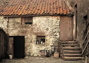 Neglected: Ramshackle cottage and courtyard, Scotland