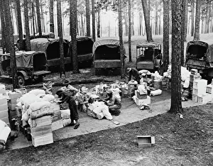 Inspecting: Rations are inspected before being loaded
