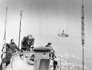 Goodwin: Raymond Baxter filming at sea, on location