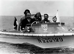 Marcellin: Raymond Marcellin riding in a boat