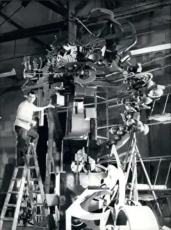 Contain: Raymond Moretti working on giant sculpture