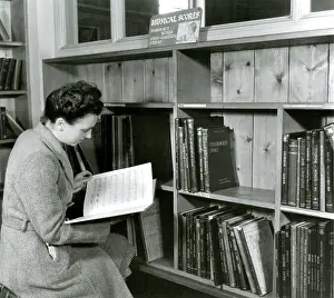 Bookshelves: Reading a score in a music library