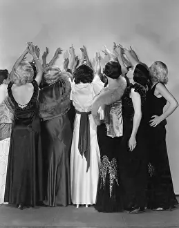 Crowding: Rear view of women reaching