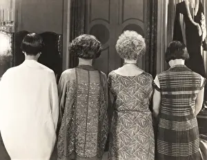 Ov1606: Rear view of four women standing in a row