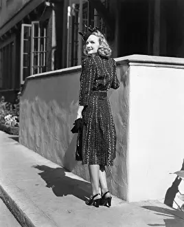 Pane: Rear view of a young woman standing in front of