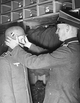 Garb: A recruit receives his uniform, 1938