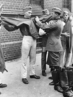 Compulsory: Recruits receive their uniforms, 1937