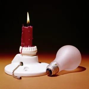 Endure: Red Candle Burning in Porcelain Electrical Light