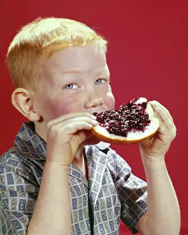 Yummy: Red Haired Boy Eating Slice of Bread with Gobs