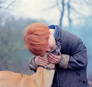 Charlwood: Red-haired gipsy boy with a dog