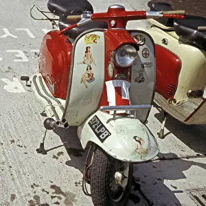 Adorn: Red and white Lambretta with stickers
