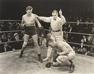 Loser: Referee counting over boxer in ring
