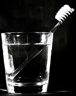 Optics: Refracted image of a toothbrush handle as seen