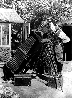 Horticultural: Reginald Malby with a giant camera in his garden