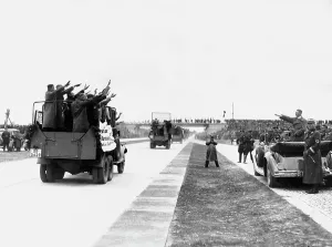 Compulsory: Reichsautobahn workers pass by Adolf Hitler