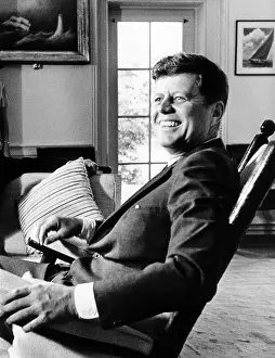 46th: A relaxed President Kennedy sits in his ?