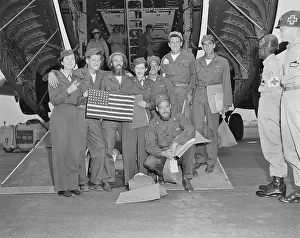 Air Force: Released POWs, a B-29 crew pose with their flight