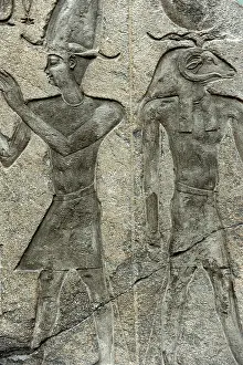 Earthly: Relief of a king and a ram-headed god. Egypt