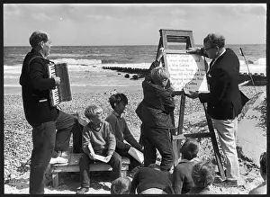 Prompting: Religious service being held on a beach