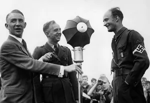 Broadcasters: A reporter is interviewing Gebietsfuehrer Erich Jahn, 19