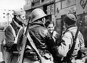 Packs: Republican fighters on their way to the front, Madrid, 1937