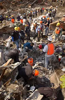 Qaeda: Rescue workers clear the rubble of the World Trade