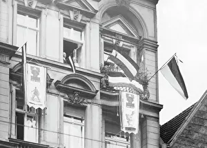 Hang: Residents of Berlin hang imperial flags out of their windows