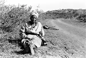 Retirees: Retired/unemployed elderly woman on a road in iSithebe