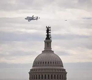Piggyback: Retiring space shuttle Discovery atop a ?