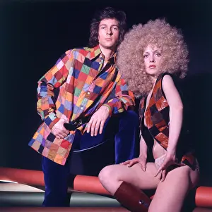 Waistcoats: Retro couple in matching patchwork outfits 1970s