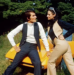 Waistcoats: Retro couple modelling pin striped suits