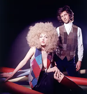 Waistcoats: Retro couple posing in matching outfits