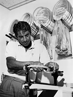 Gonzales: Richard Pancho Gonzales restringing a ?