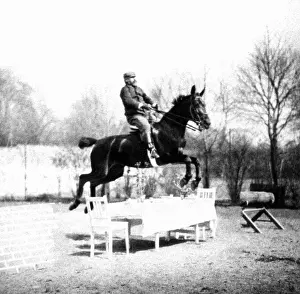 Aristocrats: Rider jumping over a table, 1907