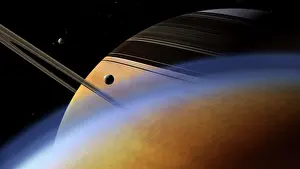 Satellites: The ringed giant Saturn rises above the haze of Titan