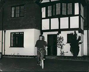 Weybridge: Ringo Starr on bicycle outside home, Weybridge, Surrey