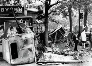Rostand: RIOTS-Parisians inspect overturned auto ?
