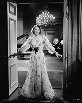 Borrow: Rita Johnson wearing an evening gown designed by Dolly Tree