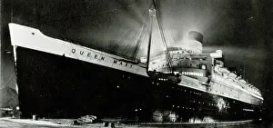 Awaiting: RMS Queen Mary bathed in floodlight before launch