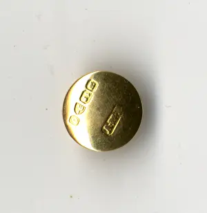 Carat: RMS Titanic - gold stud recovered by CS Mackay-Bennett